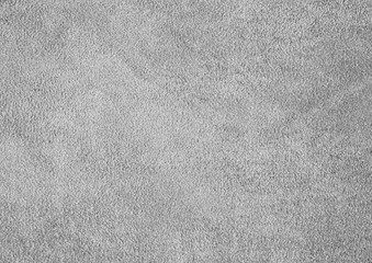 Texture of genuine leather. Suede leather texture closeup. Gray background.