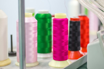 bright colors of embroidery threads on a modern embroidery machine