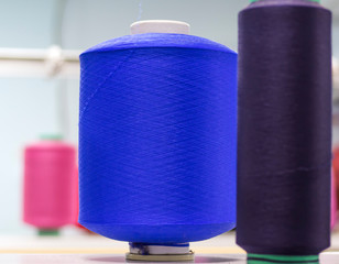 bobbins with elastic yarn on a knitting machine