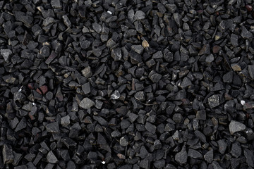 Crushed gravel texture background, background made of a closeup of a pile of crushed stone, pile of...