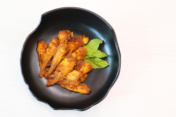 Crispy fried Golden Anchovies with Indian spices. also known as Mandeli fish fry in India.