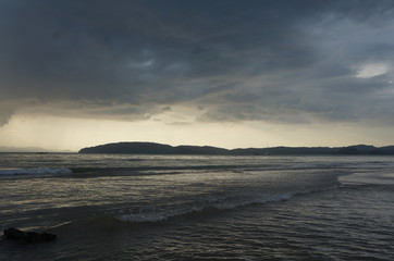  Evening tropical sea before sunset. Natural landscape background. Overcast sky.