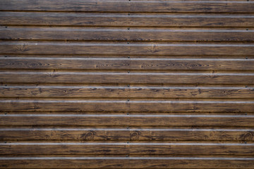 Brown wood texture outside used for fasading a house.
