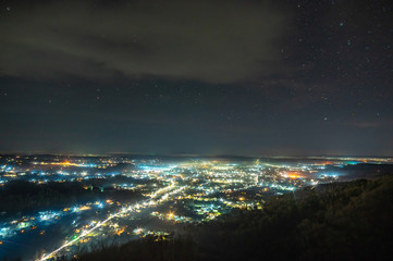 Fototapeta premium View of the night Ukrainian city in the fog