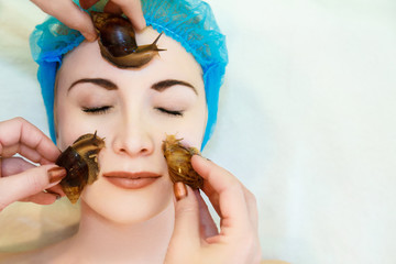 Lifting and facial massage of a young woman rejuvenates the skin in an unconventional way of the...