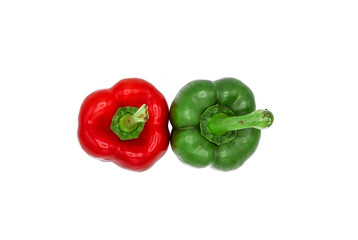 Close up top view of red and green peppers isolated to white background with selective focus