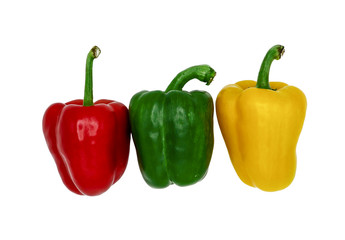 Fresh red, green and yellow peppers isolated on white background