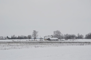 Bus journey from Vilnius to Latvia during winter time.  Suburb view with heavy snowfall along the...