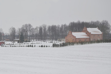 Bus journey from Vilnius to Latvia during winter time.  Suburb view with heavy snowfall along the journey.