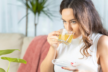 Woman drinking herb tea - obrazy, fototapety, plakaty