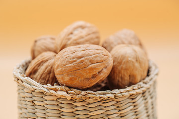 Healthy organic walnuts in a straw basket