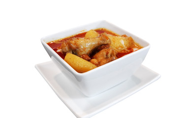 Delicious spicy curry chicken in white bowl isolated on white background, Traditional Thai food call KAENG MUSSAMUN KAI, Selective focus