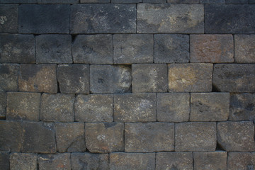 gray stone texture of the walls of the natural stone temple