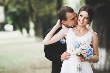 Sensual portrait of a young wedding couple. Outdoor