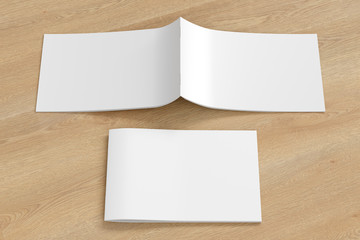 Horizontal brochure or booklet cover mock up on wooden background. Closed one brochure and upside down other. Clipping path around brochure. Front view. 3d illustratuion