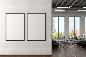 Two blank vertical posters mock up on the white brick wall in office interior. 3d render.
