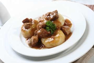 Silesian dumplings on white plate