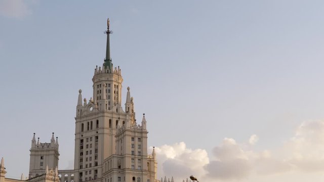 Famous Moscow skyscraper in the center of Moscow famous structure of Moscow State University. Against the backdrop of a beautiful blue sky and clouds. 4k.