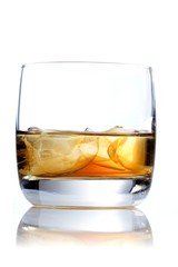 Glass of whisky on white background