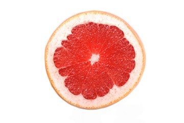 Close up of grapefruit slice on white background