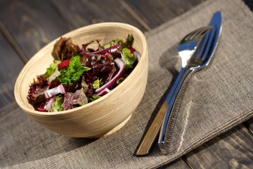Studio shot of salad at wooden table