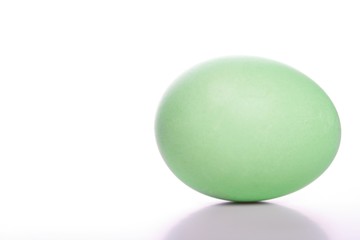 Green easter egg on white background