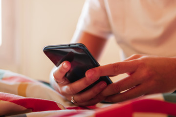 Digital millenial using mobile phone to chatt with instagram followers - Blogger comunicating with friends to meet up - Freelancer wrighting on technological smartphone the marketing plan for meeting