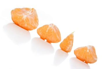 Close - up of mandarins on white background