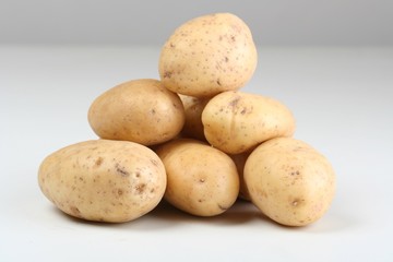 Close up of potatoes on white backround