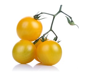 Bunch of yellow tomatoes on white backgrond