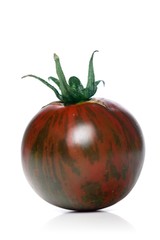 Studio shot of black tomato on white background
