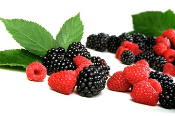 Blackberries and raspberries on white background