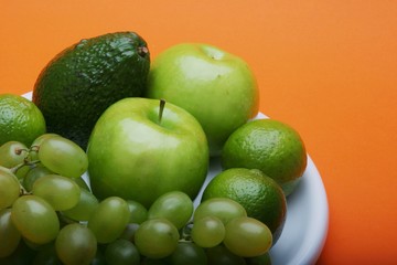 Exotic fruits on white plate