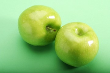 Green apples on green background