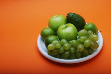 Exotic fruits on white plate