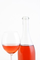 Close-up of rose wine on white background