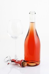 Close-up of rose wine on white background
