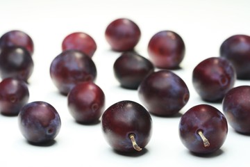 Plums on white bacground - close-up