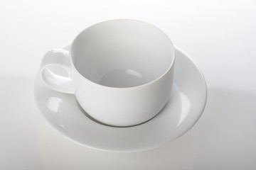 Empty cup on white background