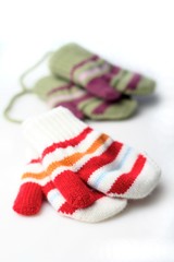 Baby gloves on white background