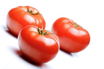 Close-up of tomatoes on white background