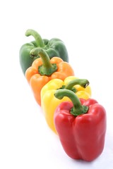 Four paprikas on white background