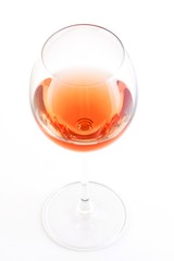 Glass of rose wine on white bacground