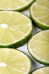 Lime slices on white background