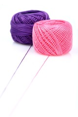 Ball of string on white background