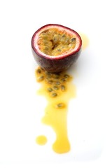 Halved passion fruit on white background