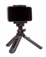 Small black tripod for smartphone isolated on white background. Close up.
