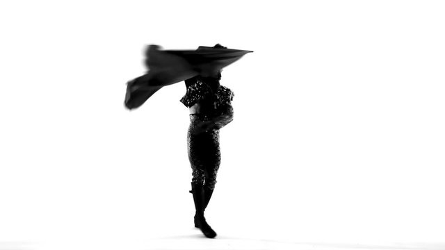 Silhouette Dancing man wearing a toreador costume. Isolated on white background in full length.