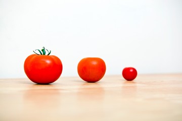 Studio Shot of three cherry tomatoes in a row