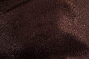 Sparkling brown leather background. Gold glittering furniture details.